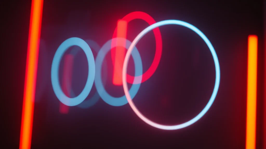Several warm glows near one another, neon on dark
