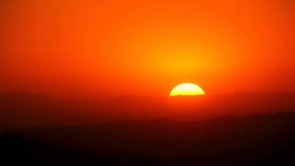 An amber backlit haze and warm gradient sky at sunset, glowing on dark